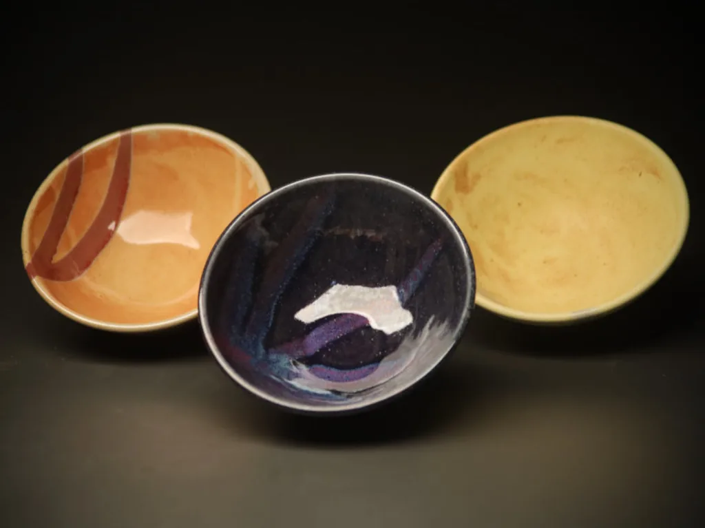 Assorted bowls arranged as a trio
