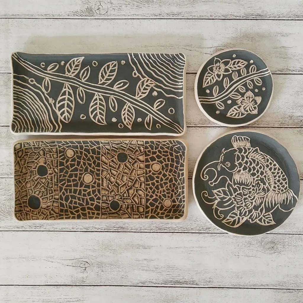 Decorated black slipware plates