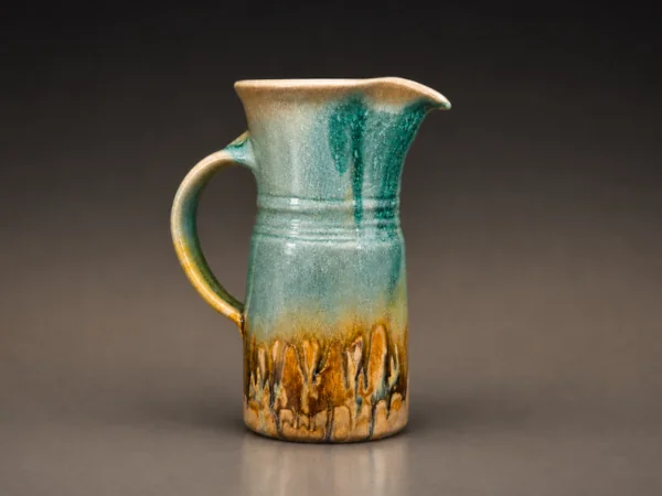 Aqua, copper, and beige drip pitcher