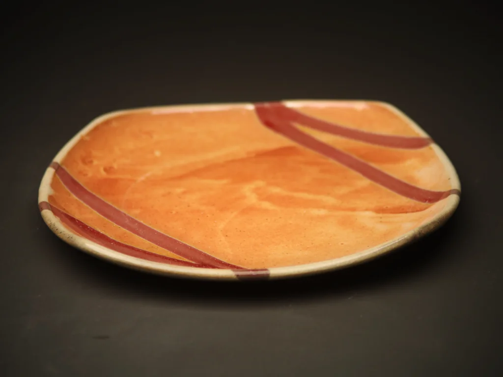 Orange platter with red stripe