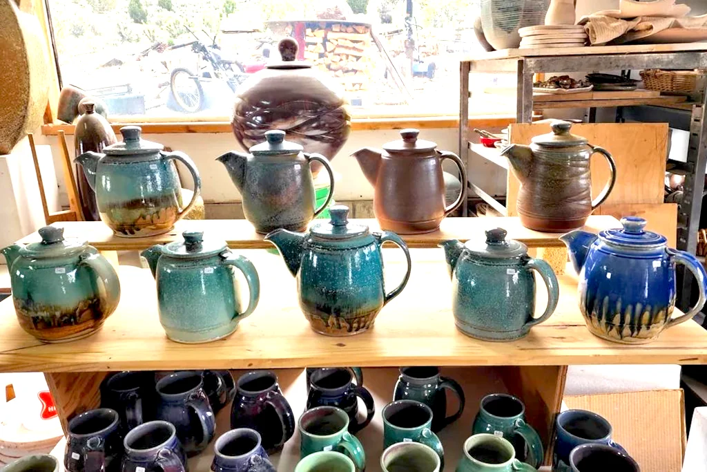 Teapot collection on shelves